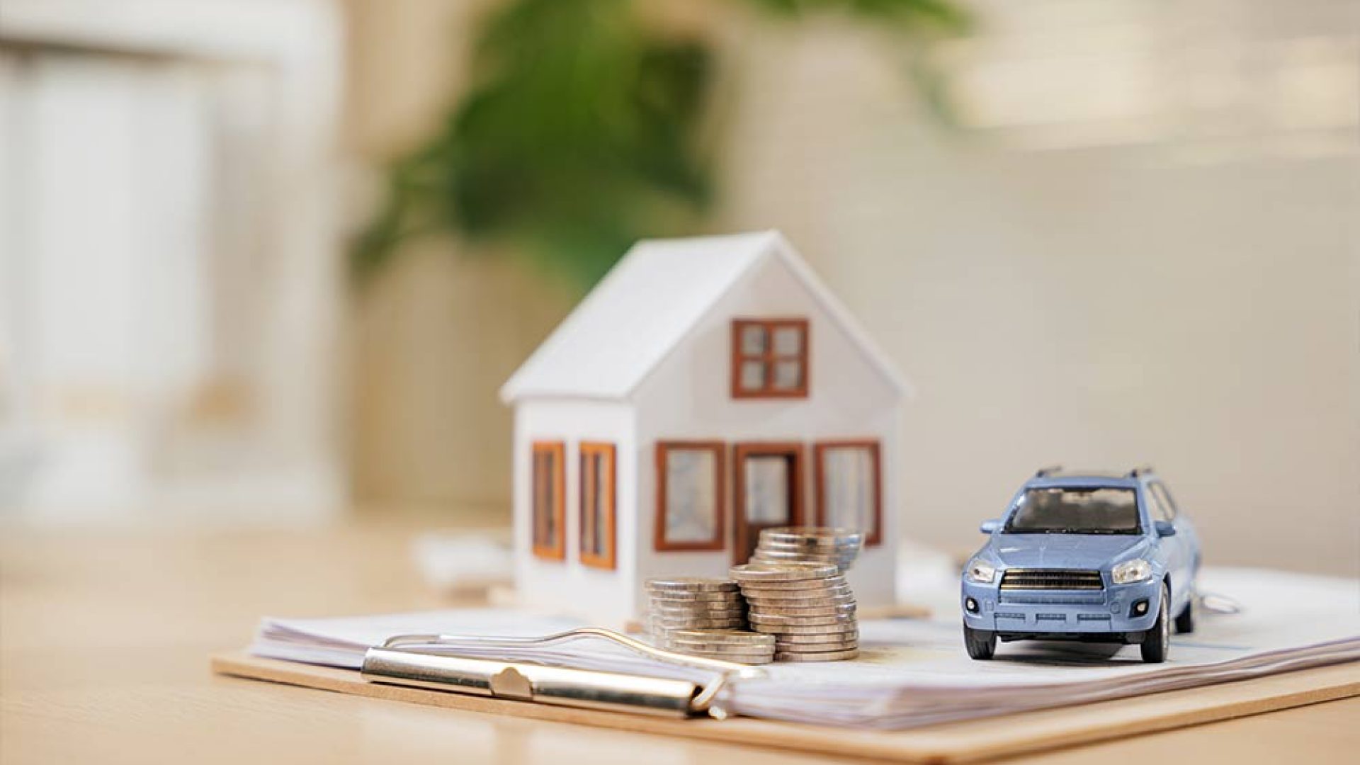 financial-planning-concept-with-car-house-model-coins-documents-represents-banking-savings-real-estate-strategies-managing-investments