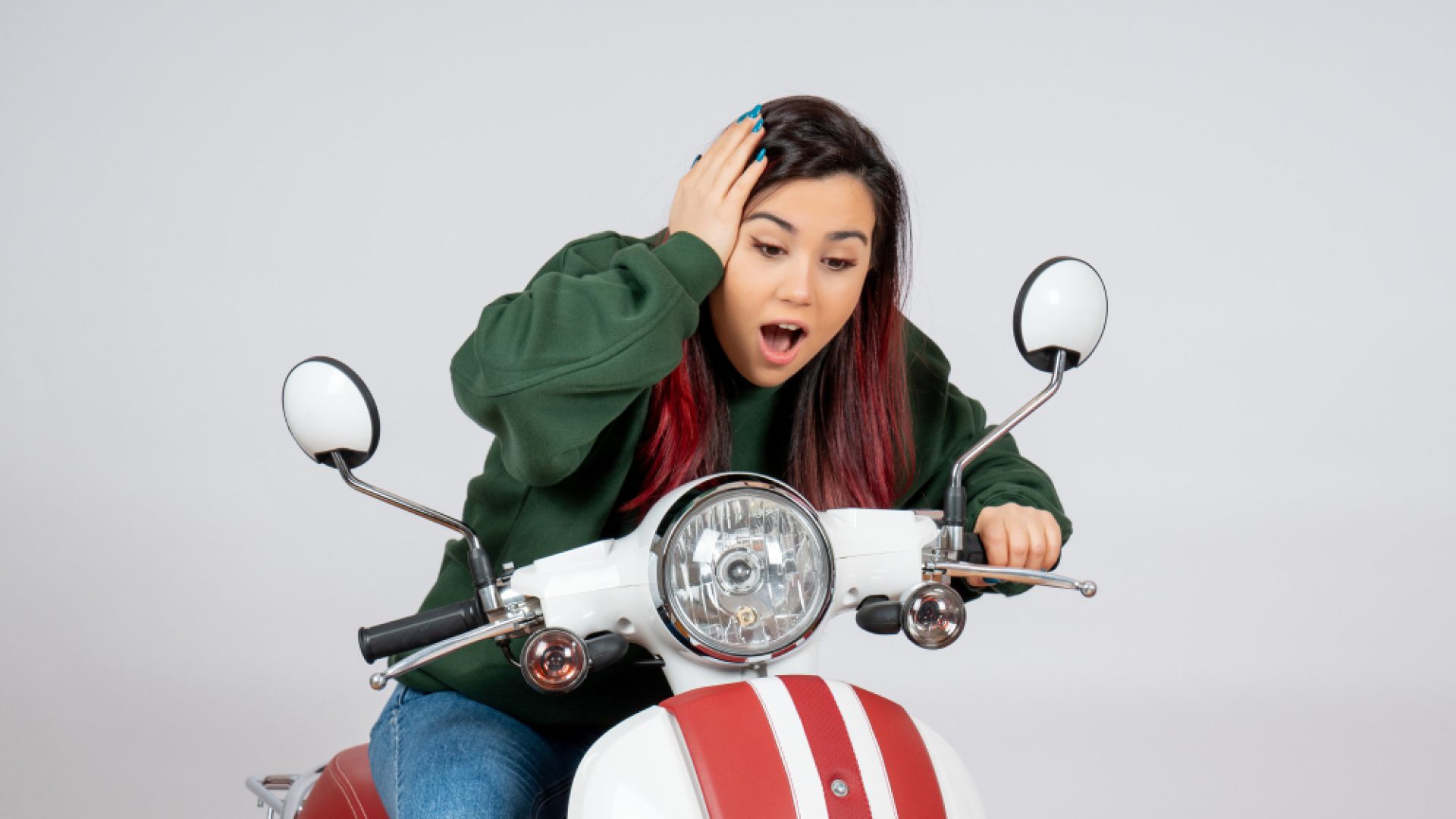 front-view-young-female-sitting-motorcycle-white-wall (1)