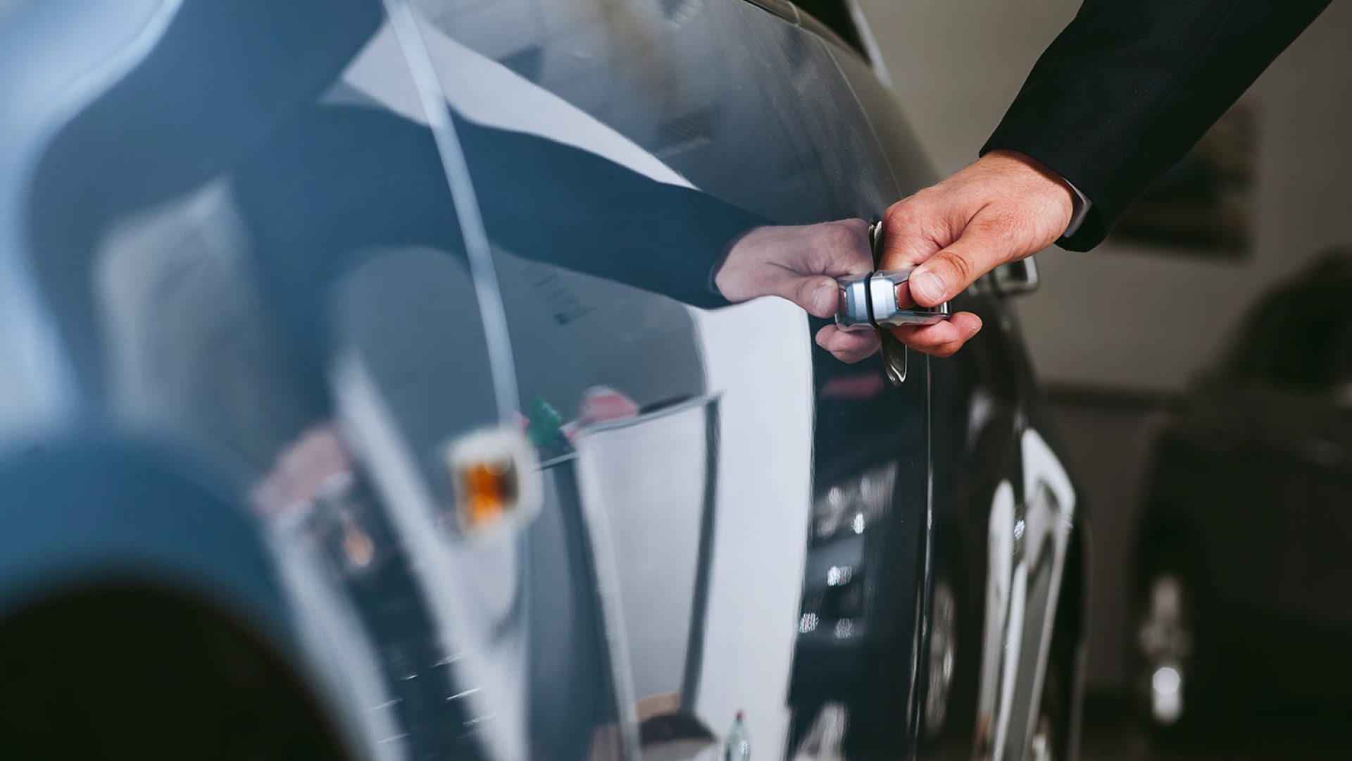 hand-car-handlehappy-man-touching-car-car-showroom-showroom (1)
