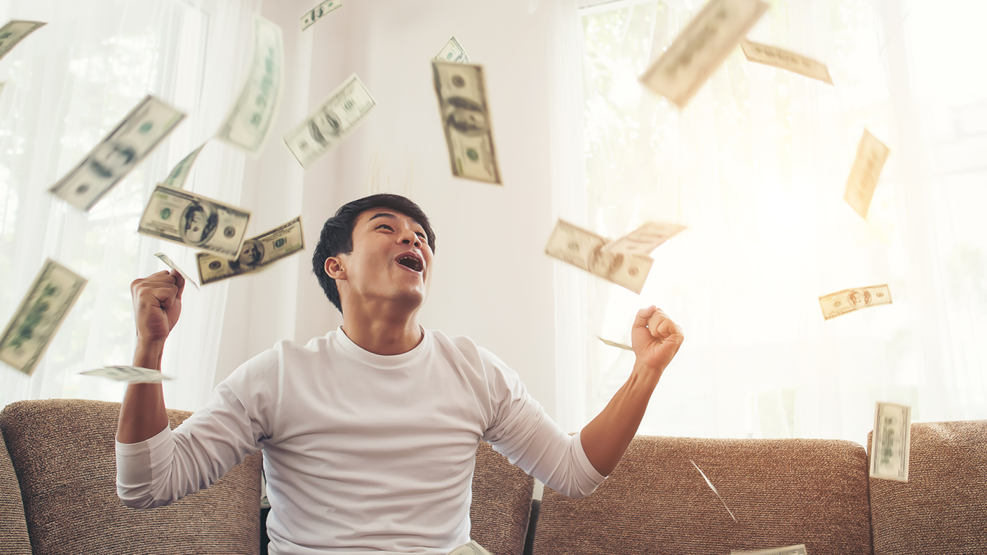 happy-man-with-cash-dollars-flying-home-office-rich-from-business-online-concept