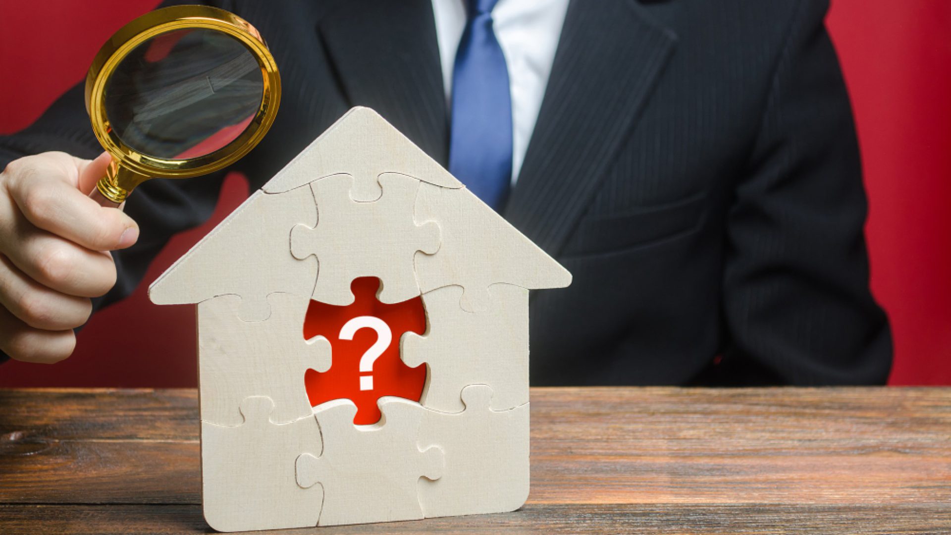man-examines-house-with-missing-puzzle-inside-property-valuation-finding-problems (1)