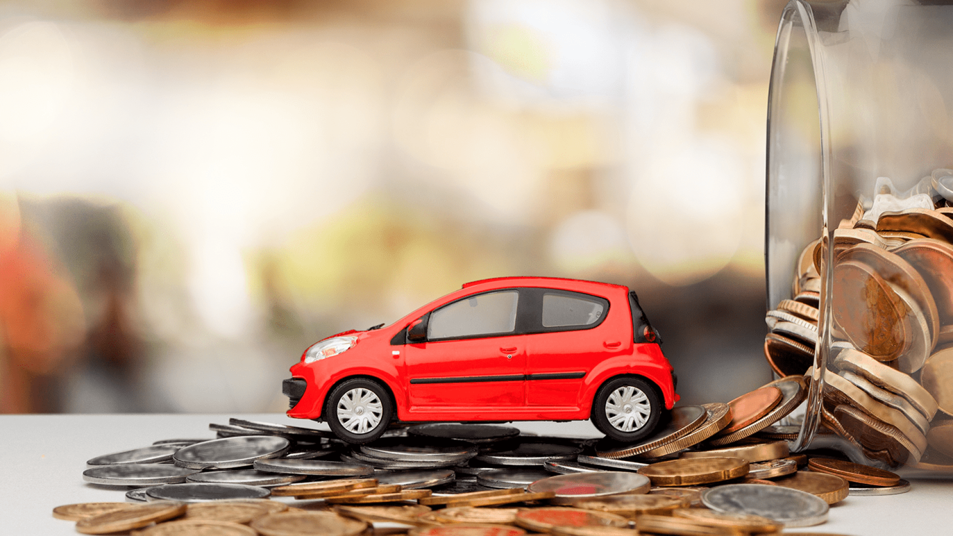 miniature-car-model-financial-statement-with-coins-finance-car-loan