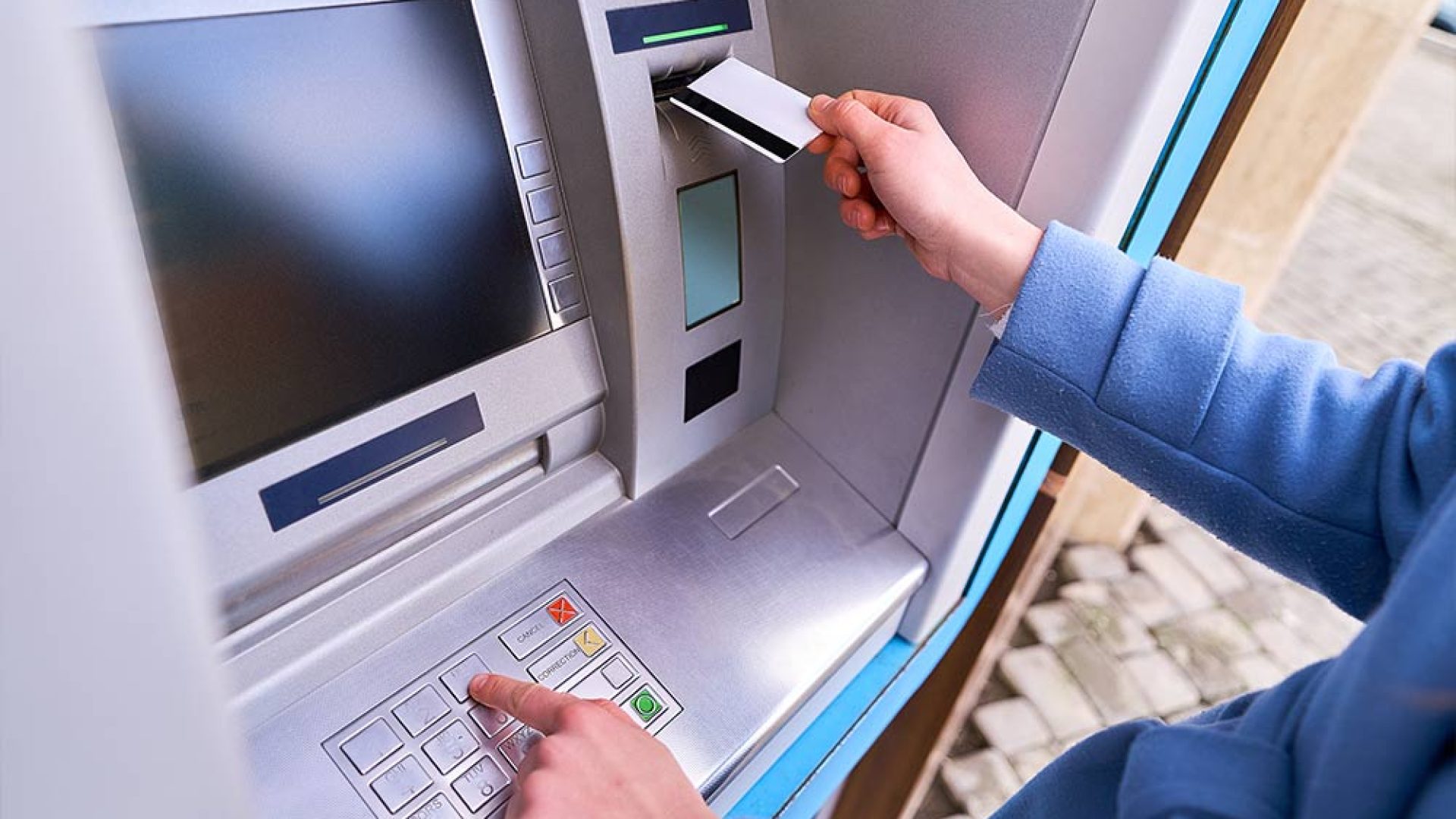 person-insert-plastic-credit-card-into-atm-bank-dials-pin-code-keyboard-withdrawing-money