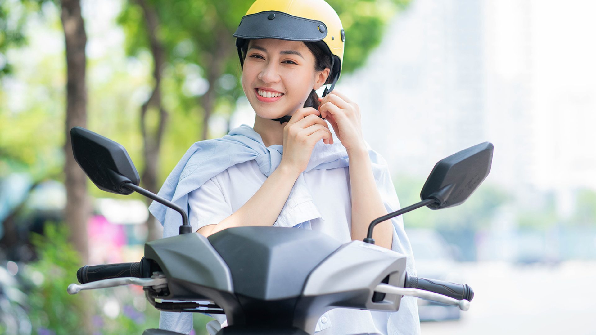 photo-young-asian-woman-driving-motorbike
