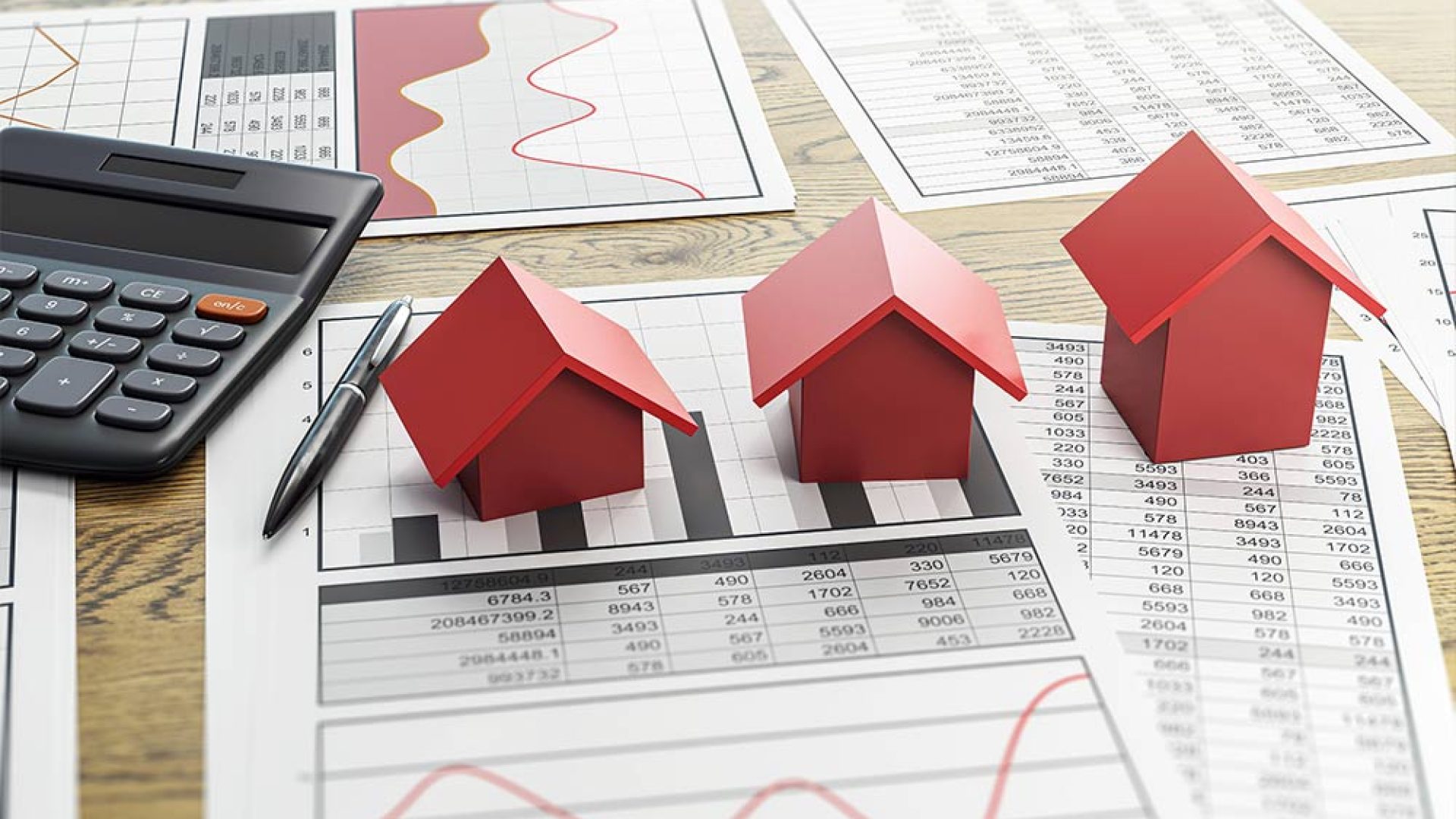 real-estate-market-analysis-with-red-house-models-calculator-pen-financial-data-charts-wooden-desk-background-daylight-setting-3d-rendering