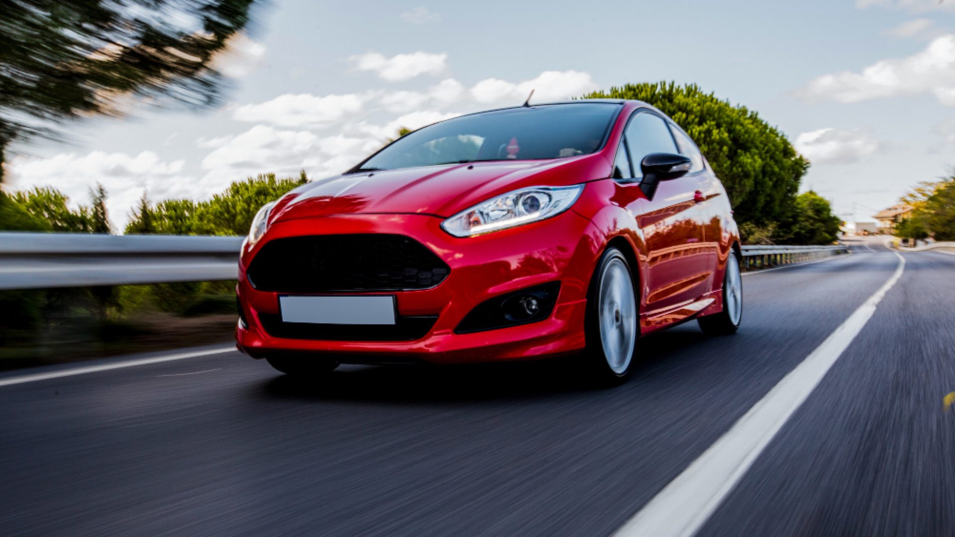 red-mini-coupe-driving-highway-with-high-speed (1)