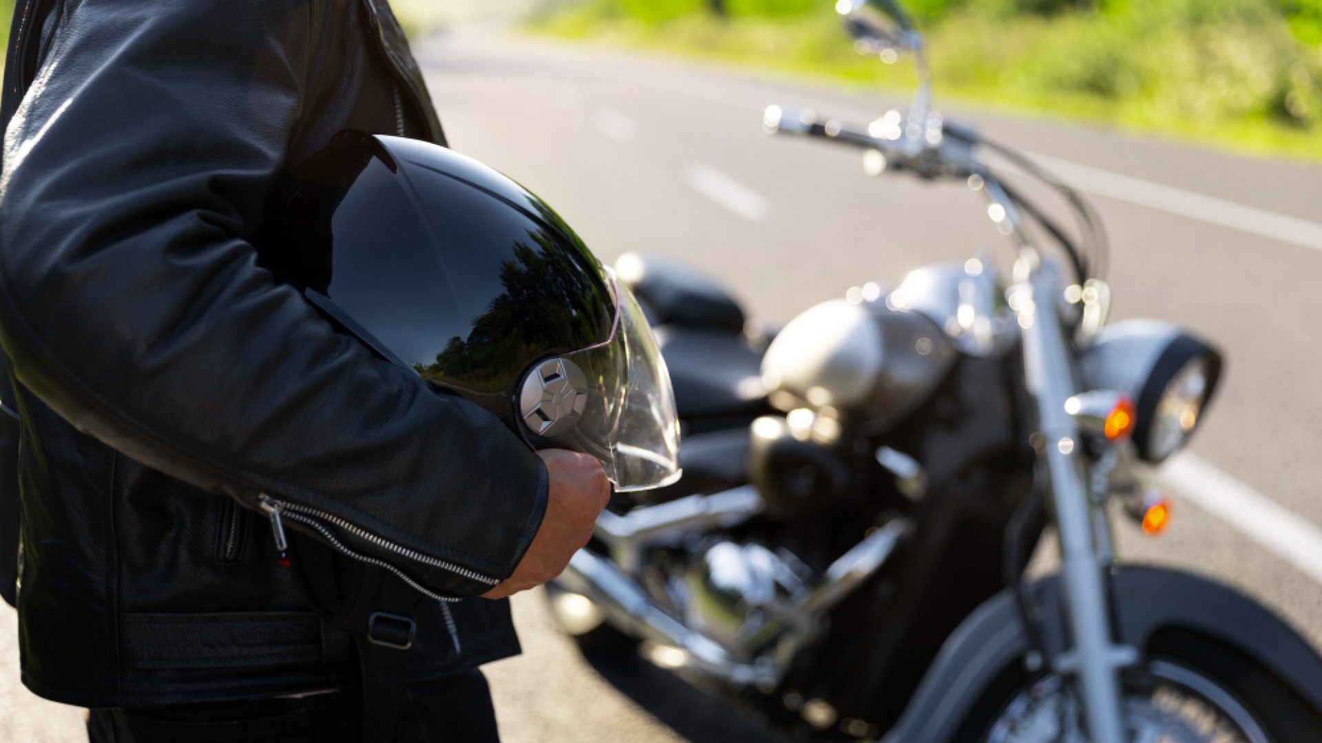 side-view-man-with-motorbike (1)