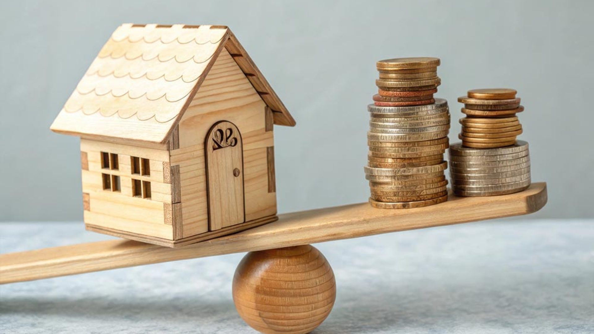 wooden-toy-house-stacked-coins-balancing-seesaw-ideal-real-estate-financial-themes-featuring-investment-concept-home-ownership-equal-balance