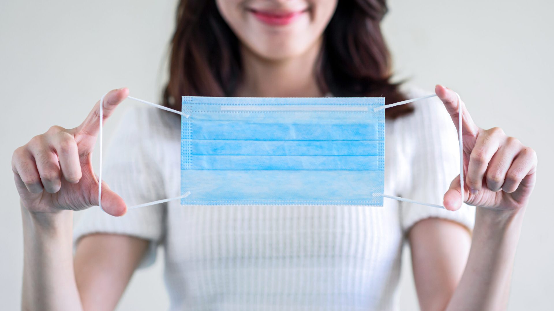 young-beautiful-asian-woman-showing-how-wear-medical-mask-showing-how-correctly-wear-hygiene-surgical-mask-step-by-step-white-background